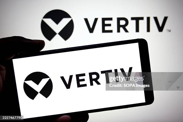 In this photo illustration, a VERTIV logo is seen displayed In this photo illustration, a VERTIV logo is seen displayed