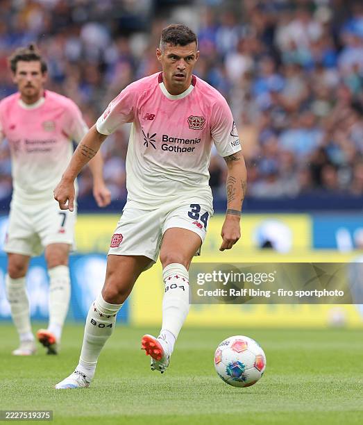 Granit Xhaka of Bayer 04 Leverkusen plays the ball during the pre-season friendly match between VfL Bochum and Bayer 04 Leverkusen at Vonovia...