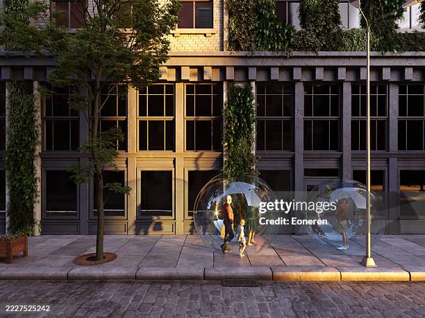 people inside glass spheres in the street - avoidance stock pictures, royalty-free photos & images