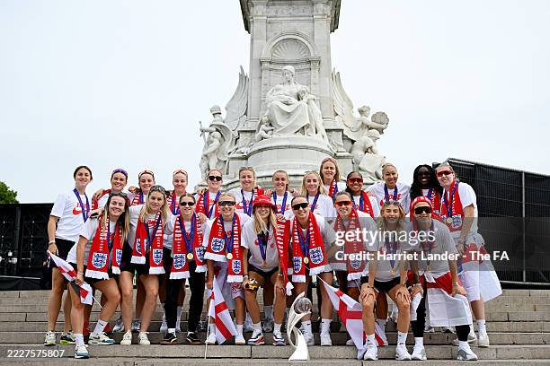 The players of England pose for a photo with the UEFA Women's EURO trophy during the England Women's team victory parade and celebration on July 29,...