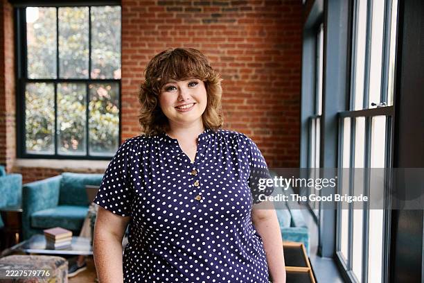 smiling young businesswoman with non-apparent disabilities - plus size stock pictures, royalty-free photos & images