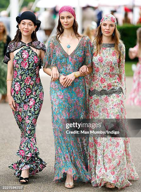Models wearing Goodwood House inspired dresses designed by RIXO on day 1 'Goodwood Cup Day' of The Qatar Goodwood Festival at Goodwood Racecourse on...