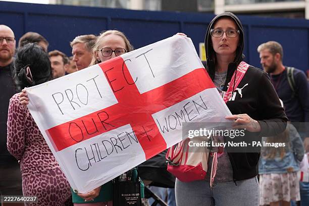 People during a protest near the Britannia International Hotel in Canary Wharf, London where asylum seekers are planned to be housed. Picture date:...