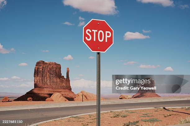 monument valley desert landscape with stop sign - stoppskylt bildbanksfoton och bilder
