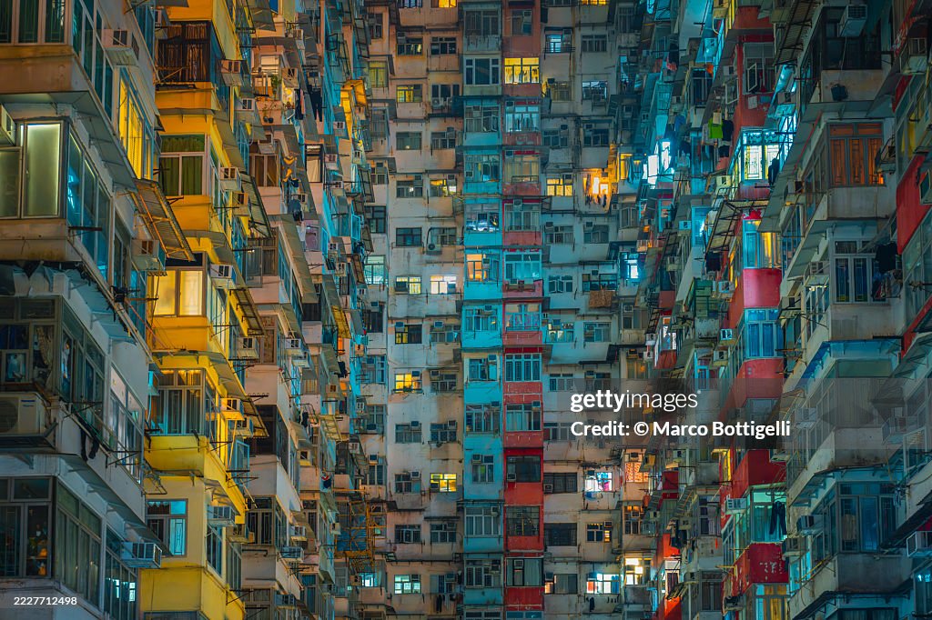 Vibrant urban residential buildings with colorful lighted windows