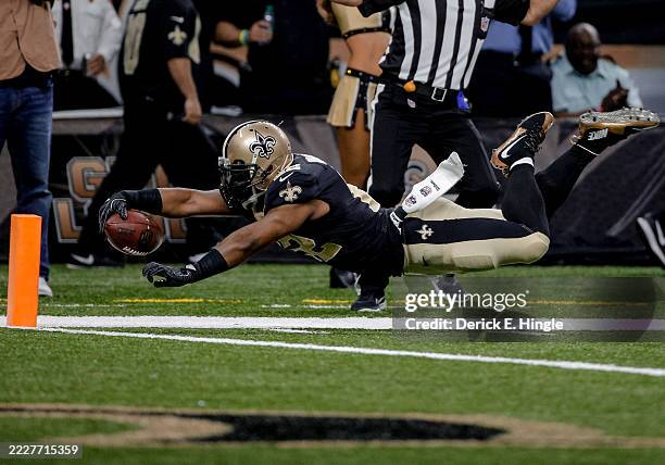 New Orleans Saints running back Mark Ingram dives forward for the pylon but is ruled out of bounds prior to the goal line during the first quarter...