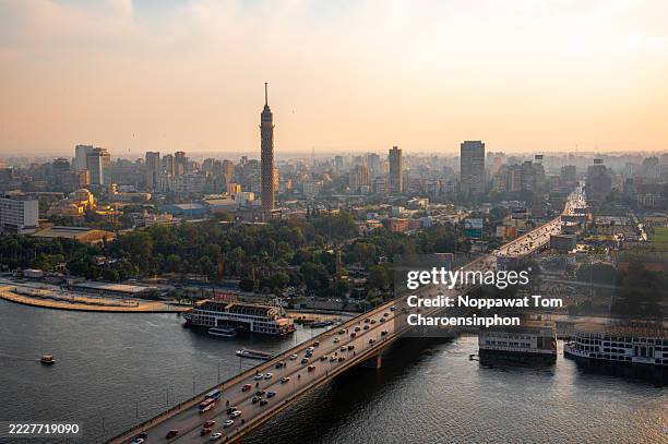 golden sunset over the nile river and cairo cityscape with cairo tower - egypt - north africa - cairo stock pictures, royalty-free photos & images
