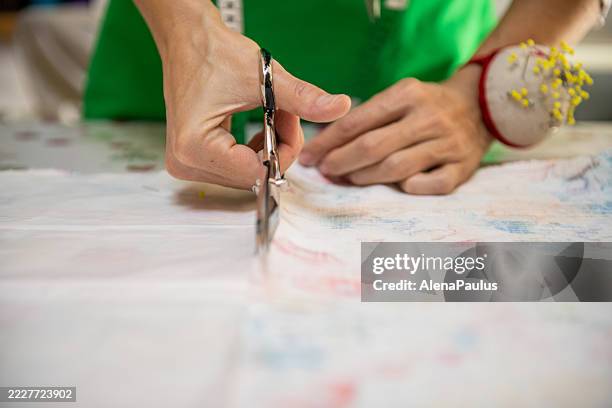 seamstress in a sewing workshop hands close up - tailors pattern stock pictures, royalty-free photos & images