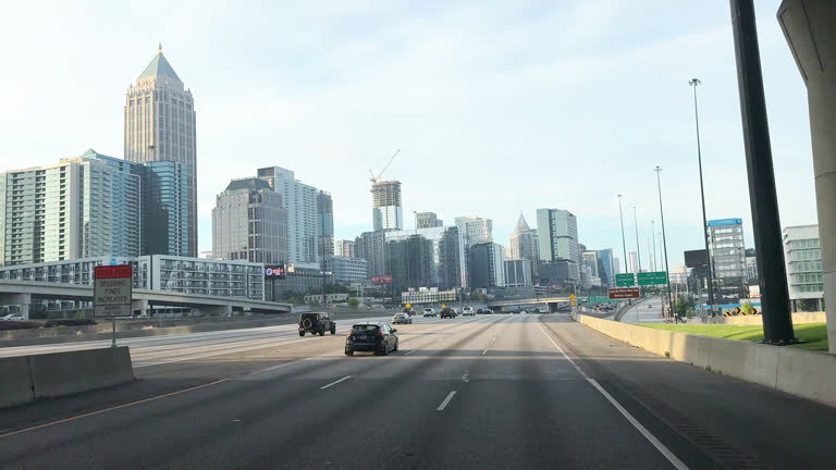 https://media.gettyimages.com/id/2227737155/video/front-of-vehicle-shot-of-cars-and-vehicles-driving-along-interstate-85-with-the-atlanta.jpg?b=1&s=640x640&k=20&c=NtdRqECP28tpw-dijwdEQCltYtpXFSuC6Exdt4BZqT0=