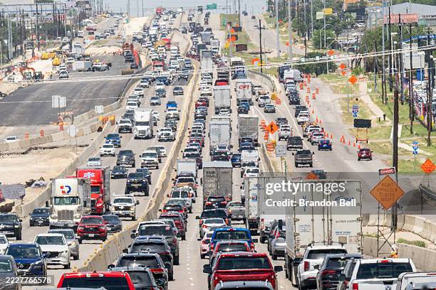 Vehicles travel along Interstate 35 on July 30, 2025 in Austin, Texas. Under the Trump administration, the EPA is seeking to repeal past findings...
