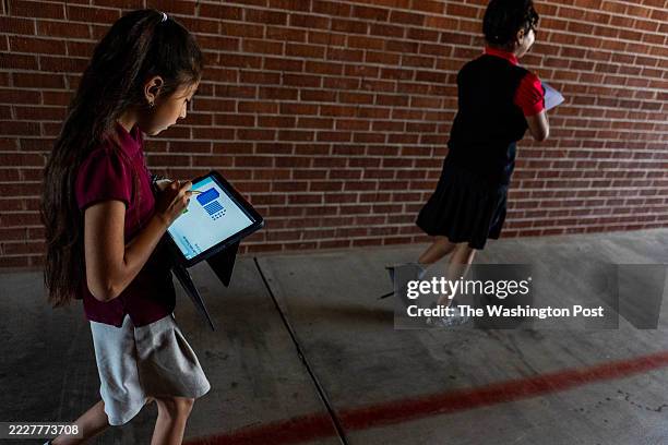 Students work on their iPads between classes at Martin Luther King Jr. Elementary School in Phoenix, Arizona on Wednesday May 14, 2025. The Roosevelt...