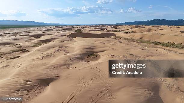 An aerial view of the Gobi Desert in Mongolia on May 24, 2025. Mongolian nomadic families and camel caravans living in the arid lands of the Gobi...