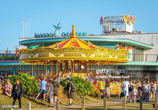carousel on paignton seafront in devon - paignton devon stock pictures, royalty-free photos & images