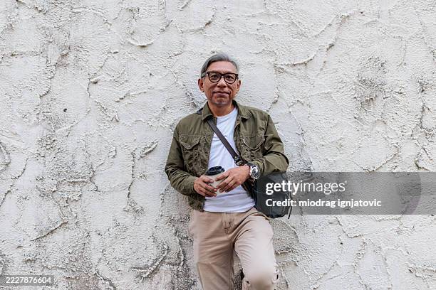 portrait of a confident modern man on the street - generation x stock pictures, royalty-free photos & images