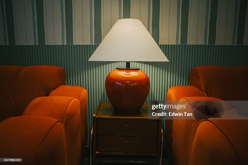Cozy Lounge Interior with Symmetrical Armchairs and Table Lamp