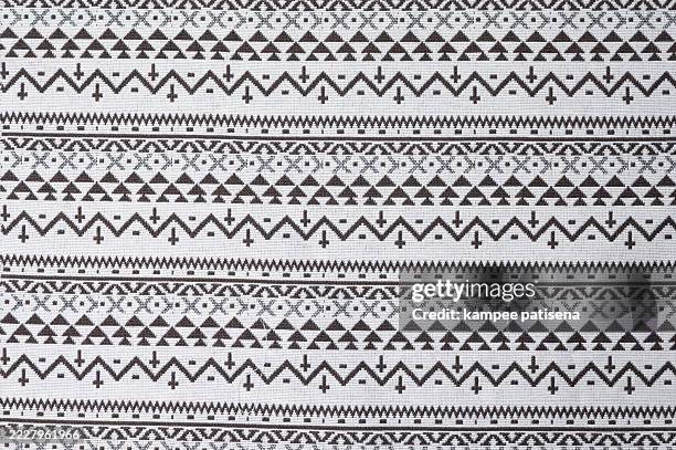 a white and black striped fabric with a pattern of triangles - poncho stock pictures, royalty-free photos & images
