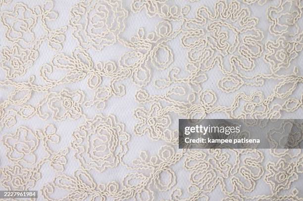full frame shot of white embroidery lacy fabric - lace textile stock pictures, royalty-free photos & images