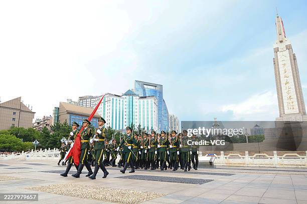 Flag-raising ceremony is held at Bayi Square to mark China's Army Day, the 98th anniversary of the founding of the Chinese People's Liberation Army ,...