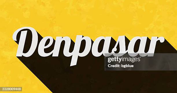 denpasar - text with long shadow on textured yellow background - bali stock illustrations