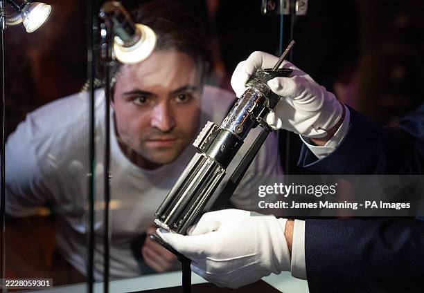 Darth Vader's hero duelling lightsaber on display at The Dorcester in London ahead of an auction in Los Angeles in September 2025. Picture date:...