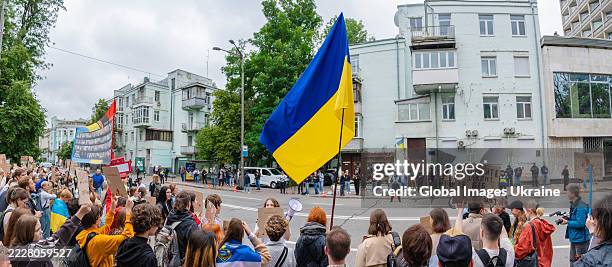 Activists with banners rally near the Verkhovna Rada to protest a law that restricts the independence of anti-corruption institutions on July 31,...