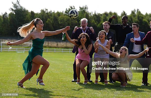 Ceili O'Connor hits the ball alongside fellow performers from Footballers Wives: The Musical during a photicall at Peffermill Playing Fields, The...