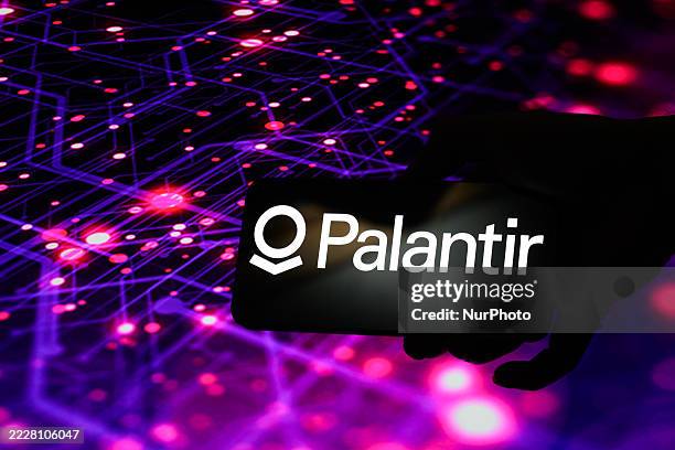 The Palantir Technologies logo is displayed on a mobile phone in this photo illustration in Brussels, Belgium, on August 6, 2025.