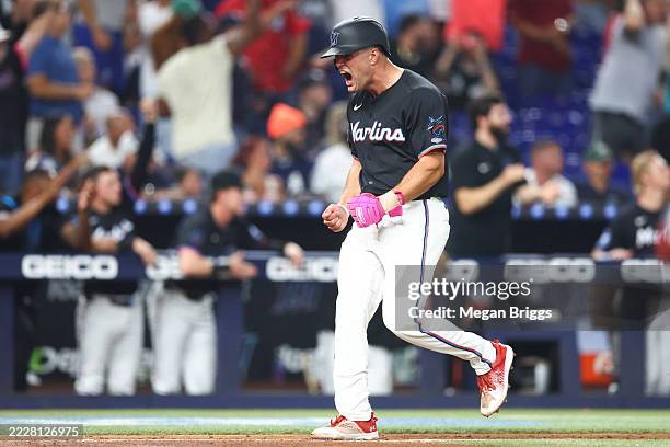 Jakob Marsee of the Miami Marlins celebrates as he runs home to score a run against the New York Yankees in the seventh inning of the game at...