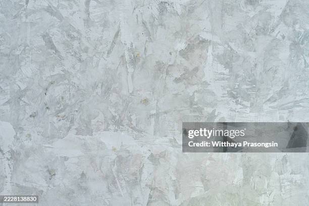 polished concrete wall exhibiting a subtle textured pattern - subtle grey pattern stock pictures, royalty-free photos & images