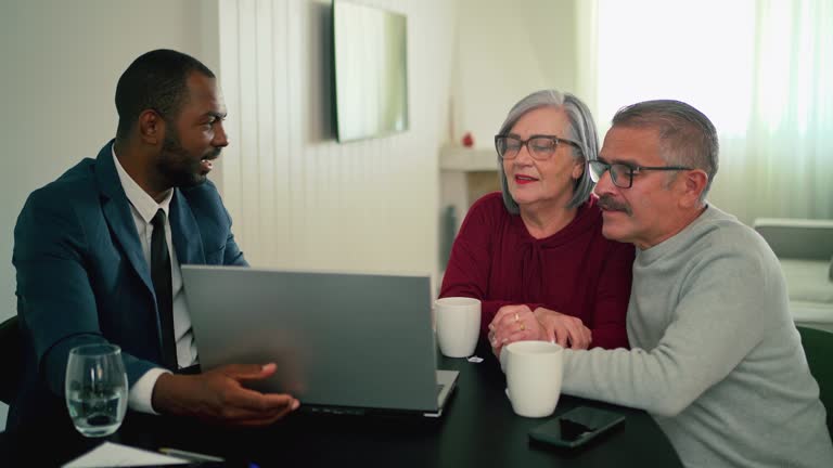 https://media.gettyimages.com/id/2228225995/video/elderly-couple-asking-a-real-estate-agent-for-help-looking-for-an-apartment-online.jpg?b=1&s=640x640&k=20&c=J03pz7nbTihCGfS11NFKLIwDLrULYeAd31ztbGIu9Uo=
