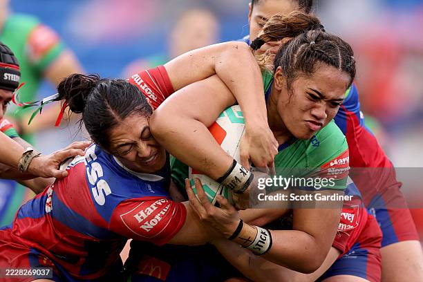 Leianne Tufuga of the Raiders is tackled by Tenika Willison of the Knights during the round five NRLW match between Newcastle Knights and Canberra...