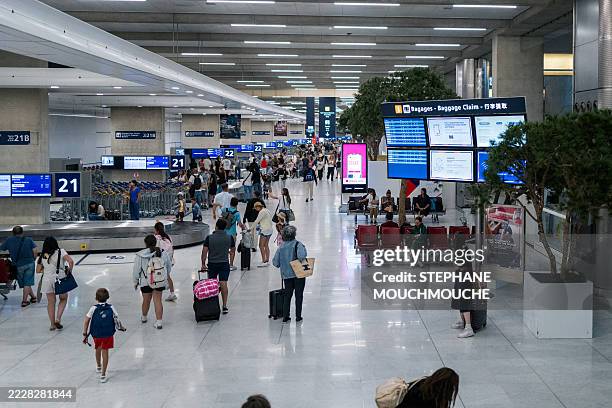 Illustrative images of Paris Roissy Charles de Gaulle airport in Roissy France on July 29 2025. Here the baggage claim area on the conveyor belts.