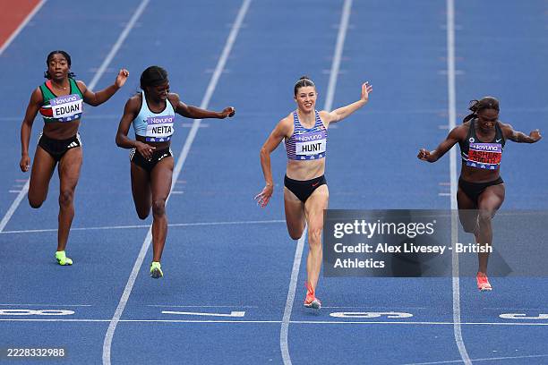 Dina Asher-Smith of Team Blackheath & Bromley Harriers A approaches the finish line before Amy Hunt of Team Charnwood AC and Daryll Neita of Team...
