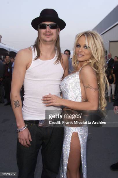 Kid Rock and Pamela Anderson arrive at the 29th Annual American Music Awards at the Shrine Auditorium in Los Angeles Wednesdsay, January 9, 2002....