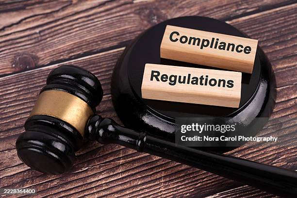 gavel and wood blocks compliance and regulations - regras imagens e fotografias de stock