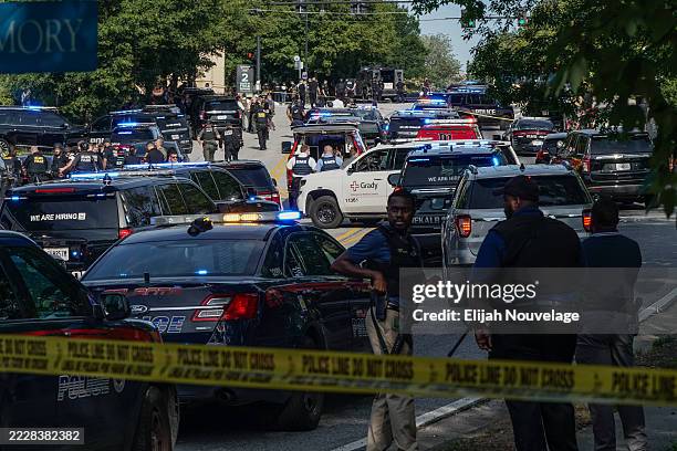 Law enforcement is seen near the Centers For Disease Control Global Headquarters during an active shooter incident on August 8, 2025 in Atlanta,...
