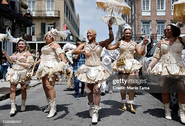 Members of the Mahogany Blue Baby Dolls including Victoria "Lady Lotus" Spotts march in the 25th Anniversary Satchmo Salute second line parade,...