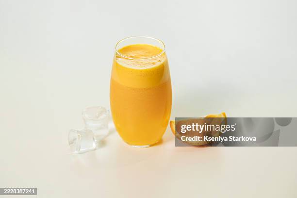 freshly squeezed orange juice - orange juice stock pictures, royalty-free photos & images