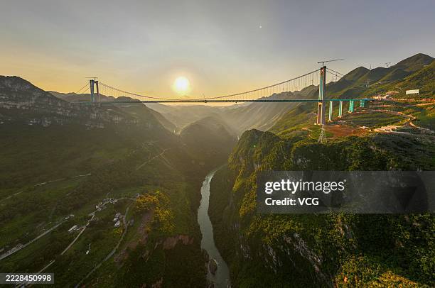 Aerial view of a construction site of the Huajiang Grand Canyon Bridge on August 2, 2025 in Qianxinan Buyei and Miao Autonomous Prefecture, Guizhou...