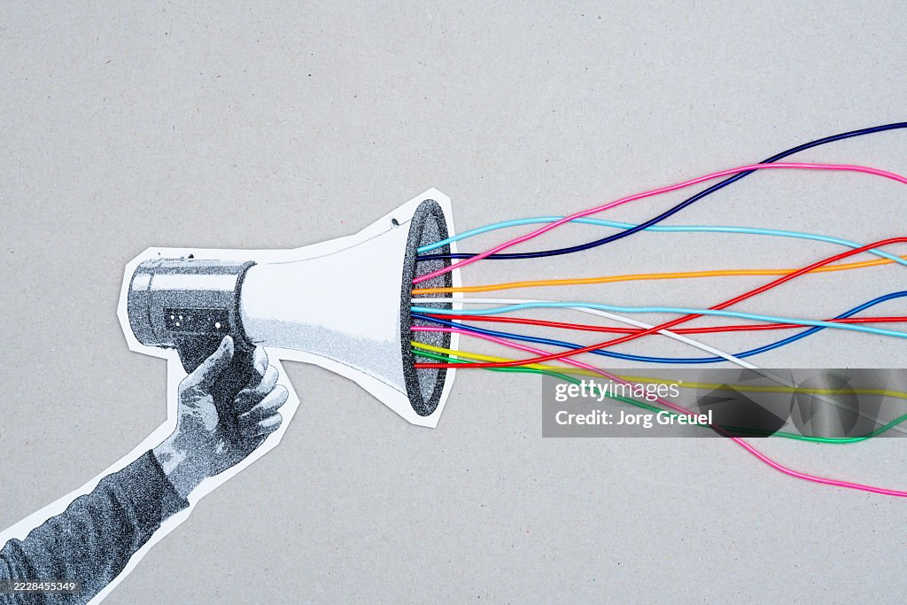 Colorful strings coming out of a megaphone