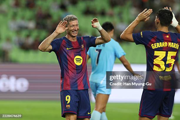 Robert Lewandowski of FC Barcelona celebrates scores his side’s second goal during the pre-season friendly between FC Barcelona and Daegu FC at Daegu...