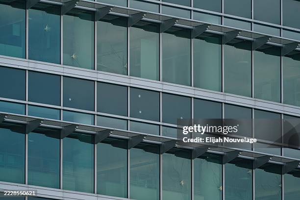 Bullet holes are seen in windows at the Centers For Disease Control Global Headquarters following a shooting that left two dead, on August 9, 2025 in...