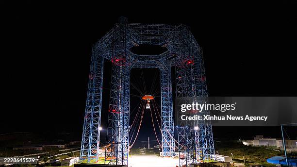 This file photo shows a manned lunar lander during a trial at a test site in Huailai County, north China's Hebei Province. China on Thursday...