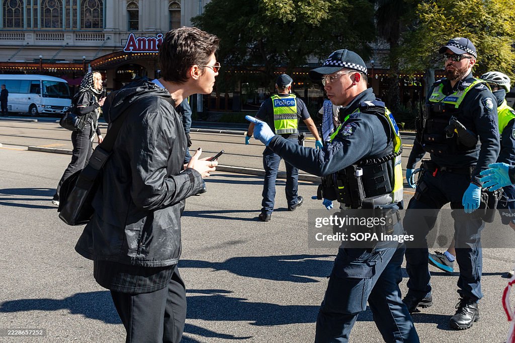 Pro Police A police officer tells a protester to move on during pro-Palestine ...