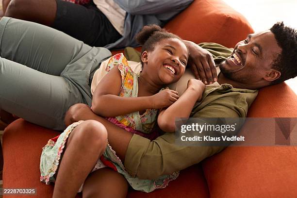 happy father and daughter enjoying leisure time at home - single father stock pictures, royalty-free photos & images