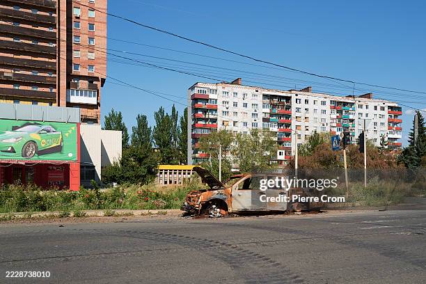 Charred remains of a vehicle hit by a Russian FPV drone lie abandoned on a street on August 10, 2025 in Kostyantynivka, Ukraine. U.S. President...