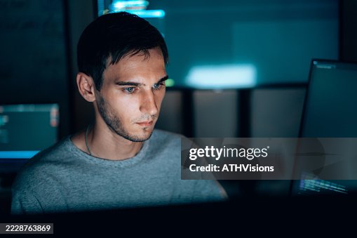 Cybersecurity specialist analyzing code on screen Cybersecurity specialist analyzing code on screen