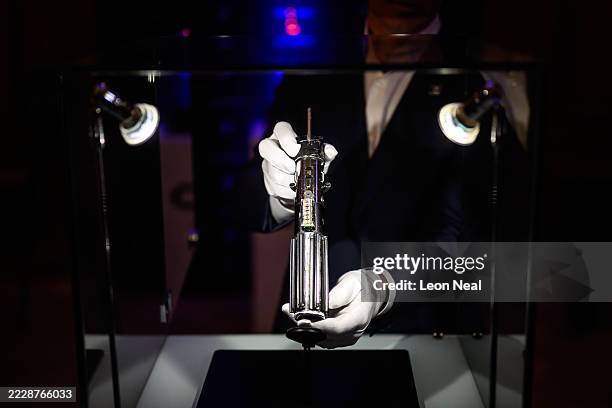 The screen-matched lightsaber prop, used by the character "Darth Vader" in the Star Wars films "The Empire Strikes Back and "Return Of The Jedi", is...