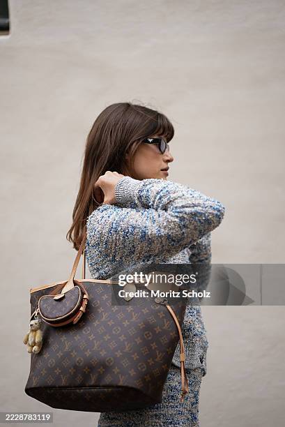 Lea Naumann, attending the Rave Review show during Copenhagen Fashion Week SS26, is seen wearing a textured grey and blue speckled boucle knit twin...