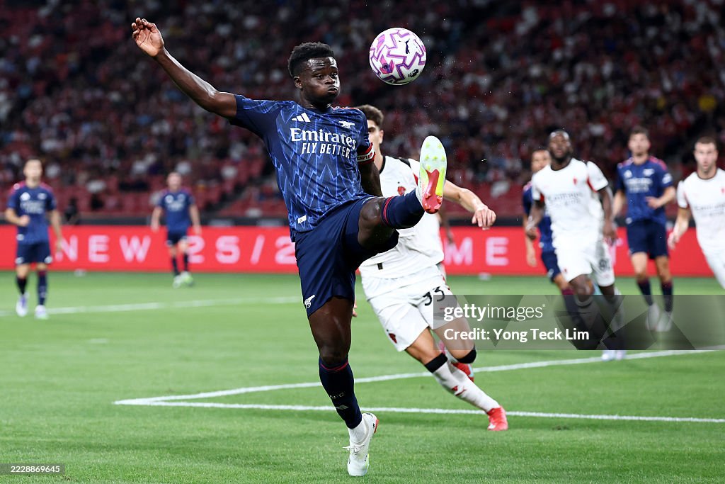 Arsenal Controls Bukayo Saka of Arsenal controls the ball against Davide Bartesaghi of ...